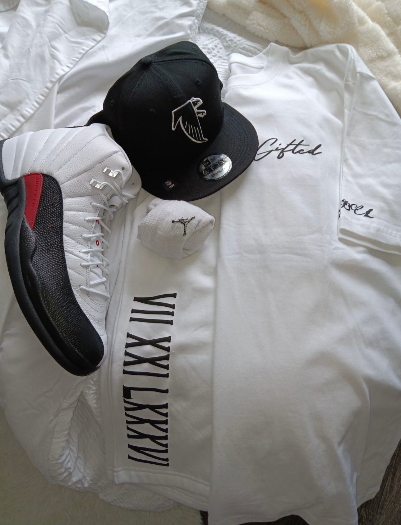 White graphic tee set featuring a stylish Gifted By Laure’alle & Co. design with matching accessories