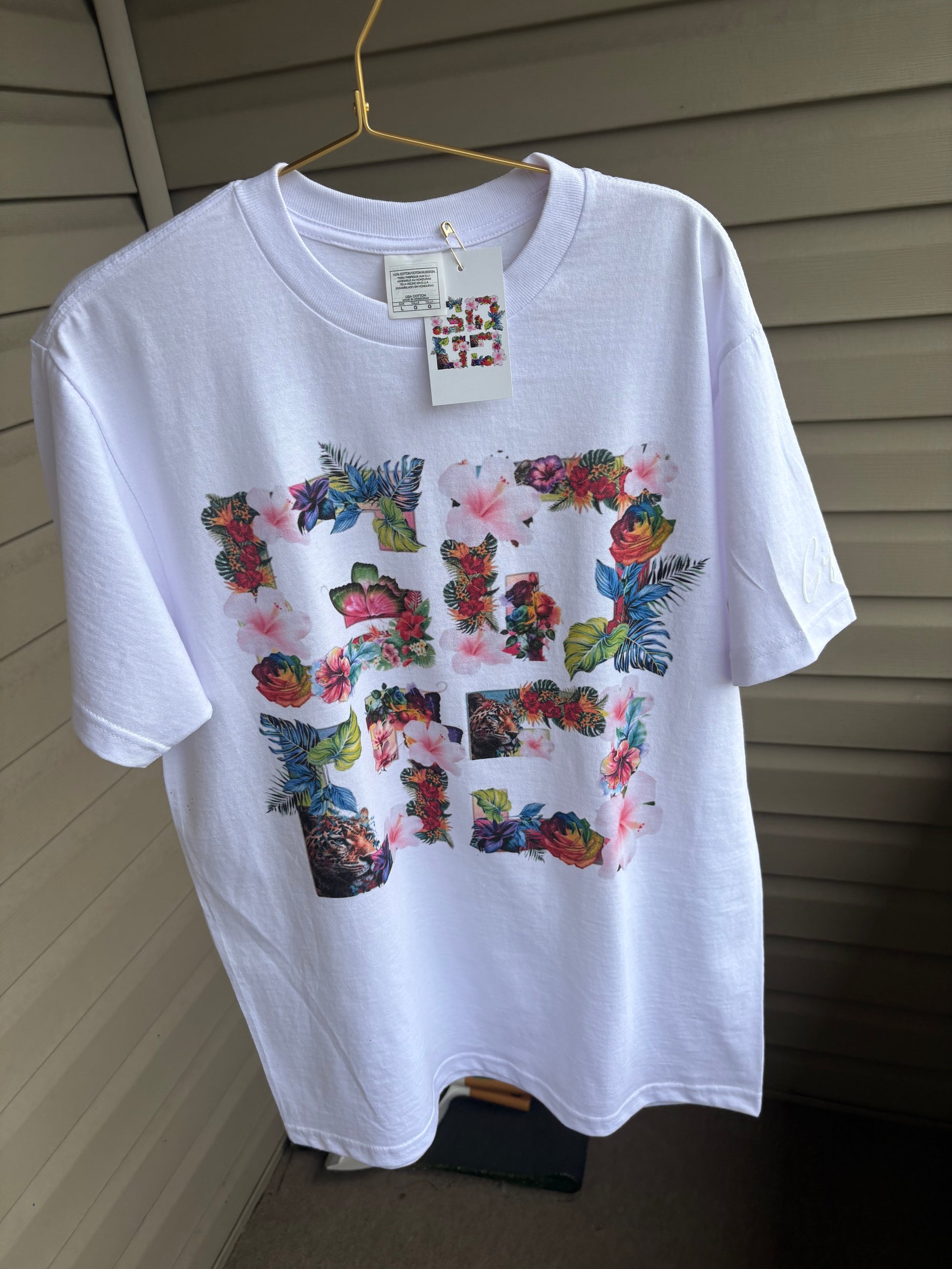 White custom floral t-shirt featuring vibrant floral graphics and a comfortable fit for casual wear