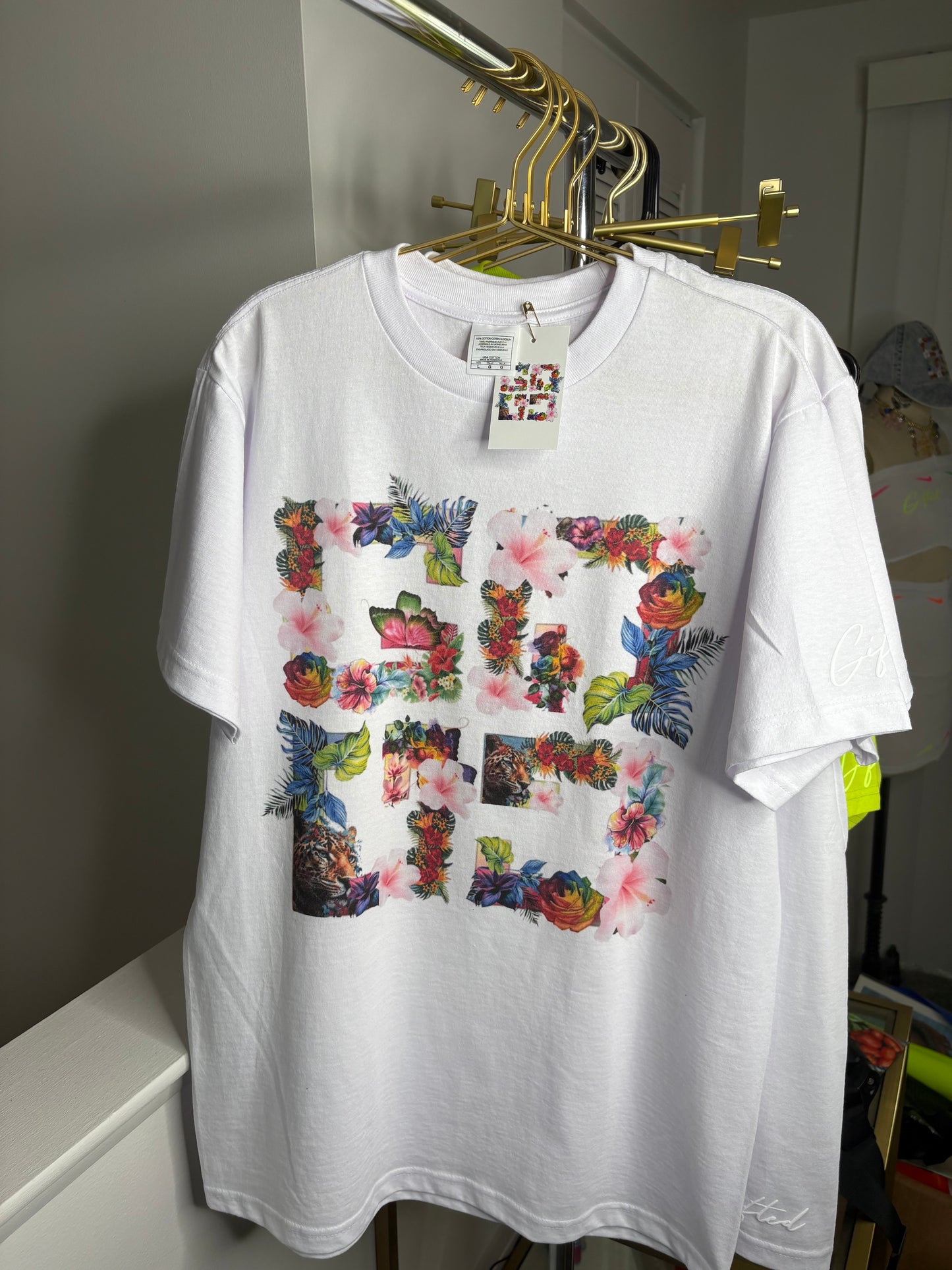 Custom floral t-shirt in white featuring a colorful floral graphic design, perfect for casual wear