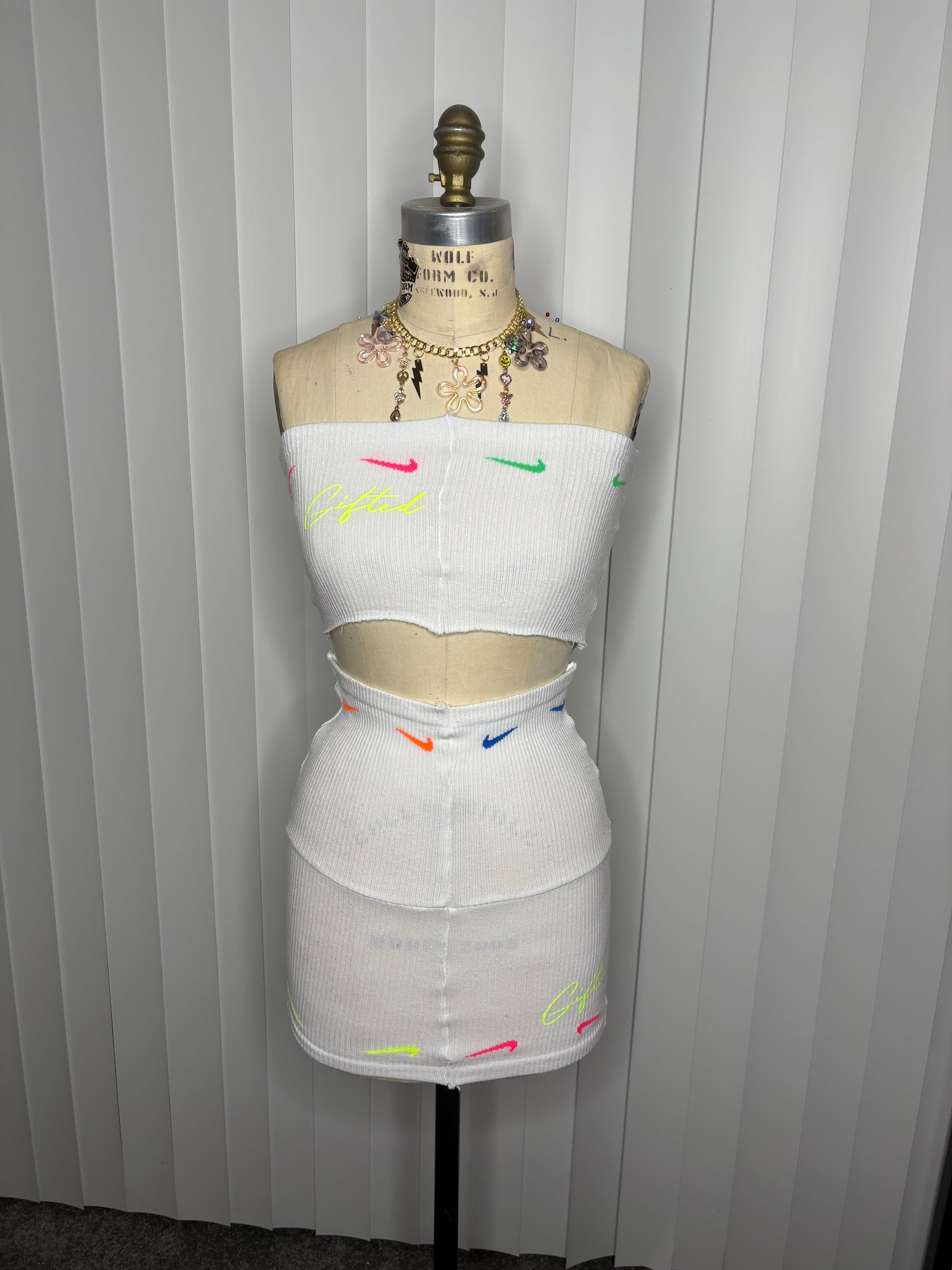 Custom white Nike skirt set featuring vibrant logo accents for a stylish summer look