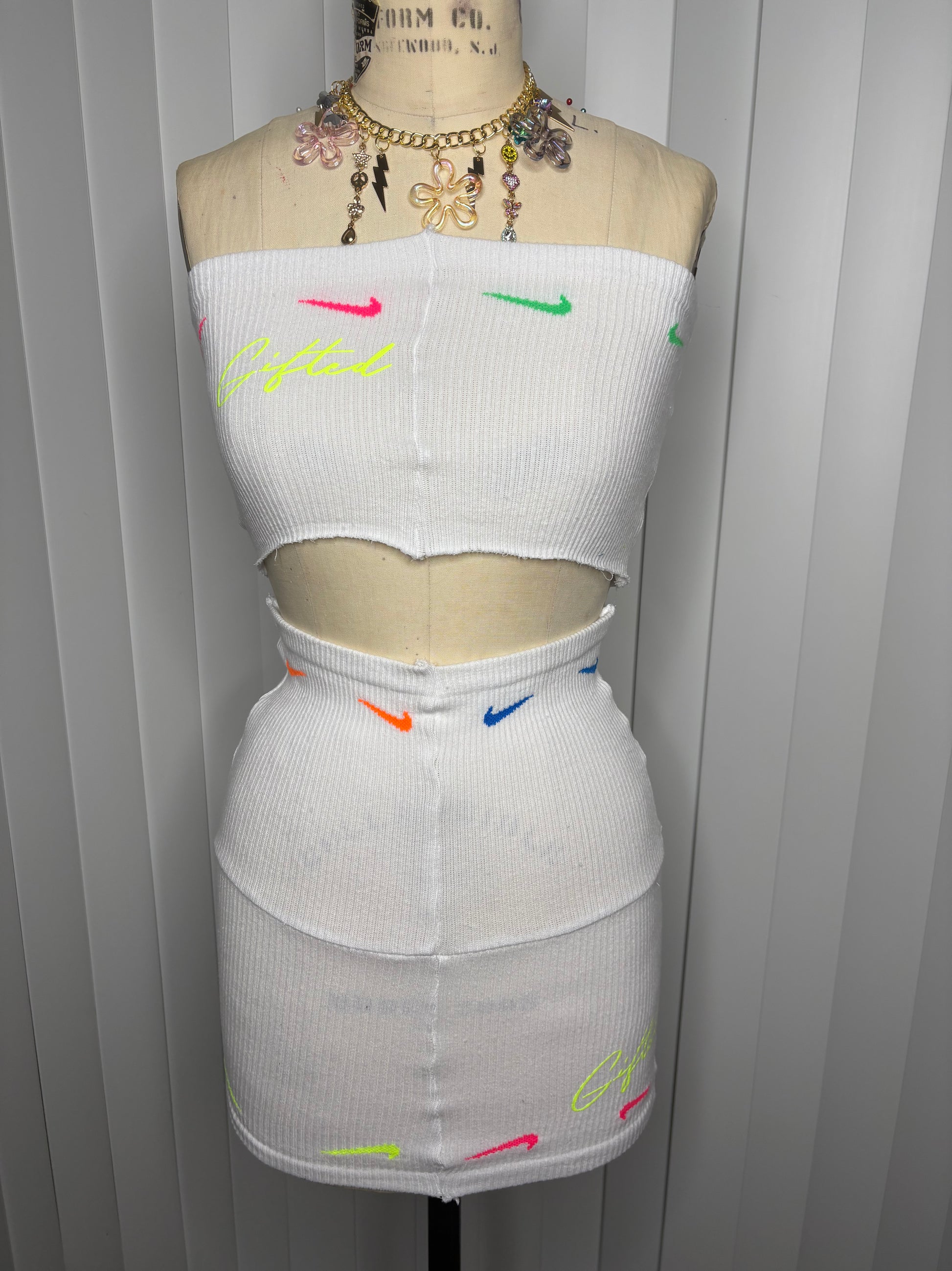 Custom white Nike skirt set featuring a trendy crop top and fitted skirt with colorful accents