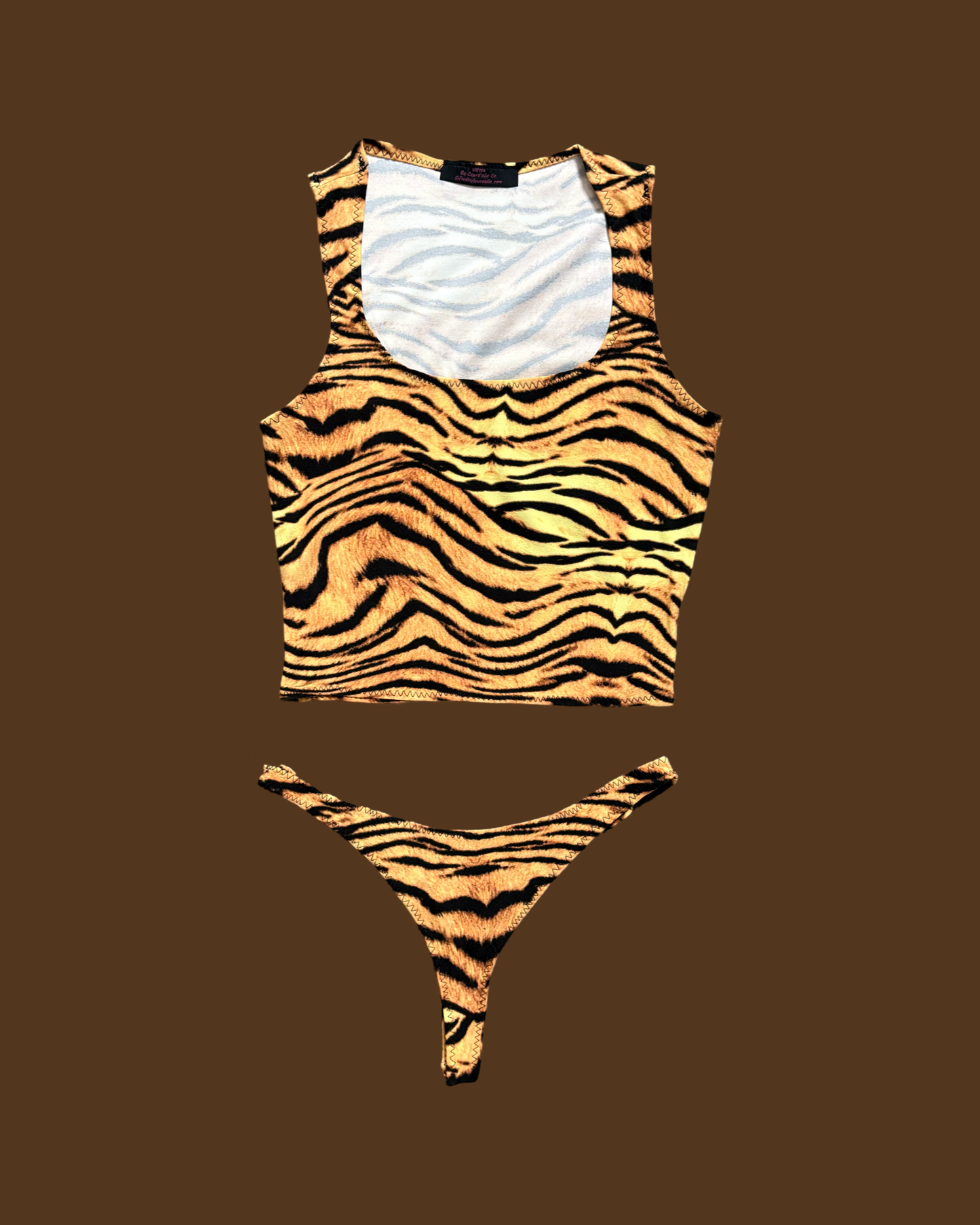 Tiger print loungewear set featuring a stylish crop top and matching thong for casual comfort