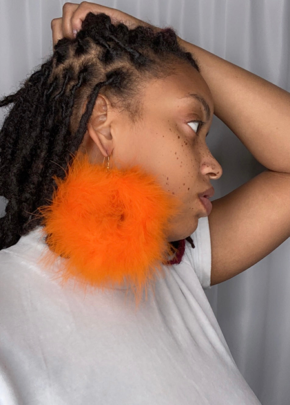 Orange fur hoop earrings