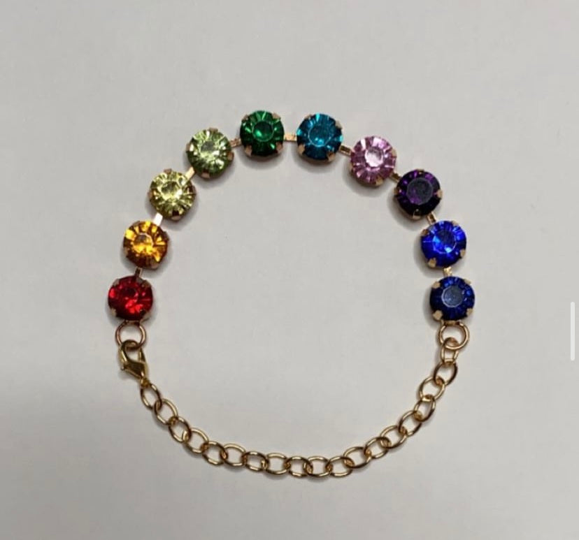 Handmade rainbow anklet featuring colorful gemstones in vibrant hues on a gold chain
